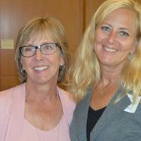 Two alumnae posing for a photo
